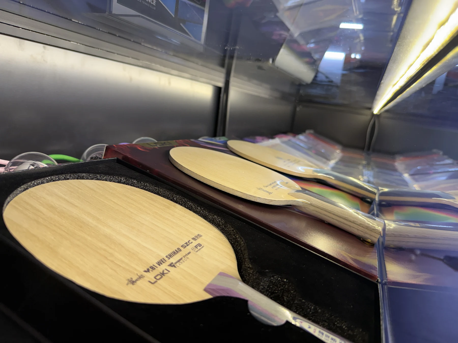 A close-up of table tennis blades in the DTB display cabinet